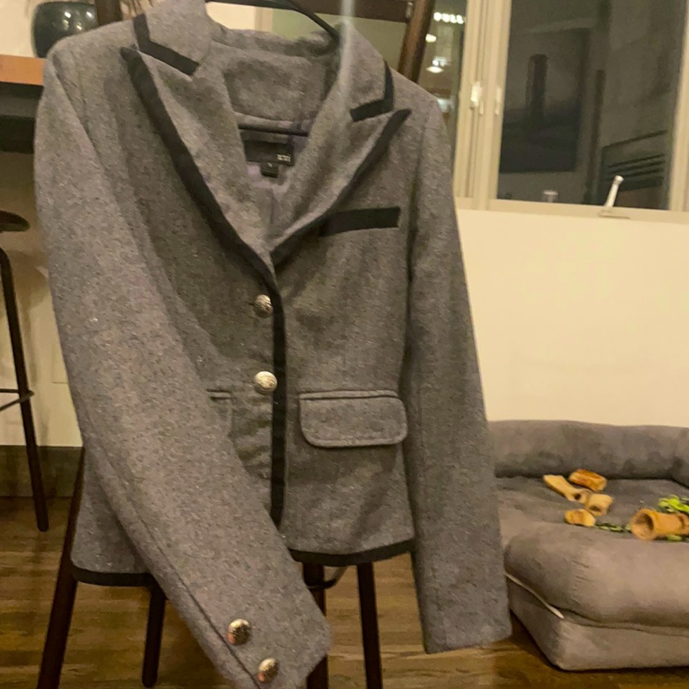 Small sweater blazer. Grey with black trim and silver buttons.